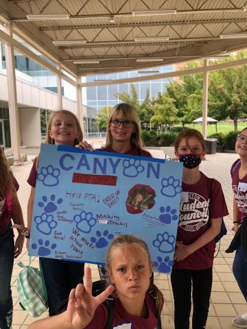 Student council members make a canyon poster
