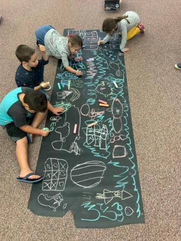 students using chalk