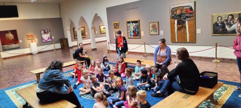 Students listening about the museum