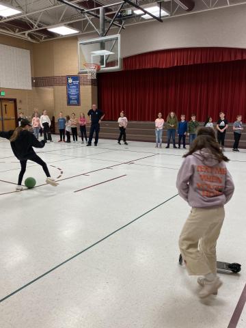 students kicking ball