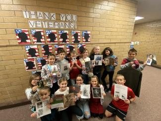 Mrs. Warner's class brought family pictures of veterans