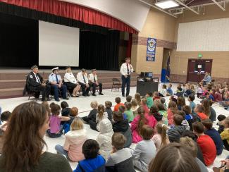 Students listening to local Veterans